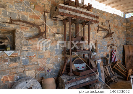 Ancient wooden screw press for traditional olive oil extraction 140833062