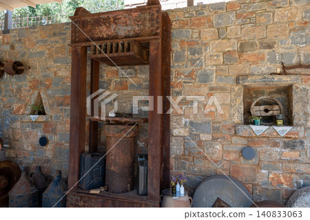 Ancient wooden screw press for traditional olive oil extraction 140833063