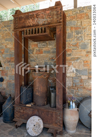 Ancient wooden screw press for traditional olive oil extraction Ancient wooden screw press for traditional olive oil extraction 140833064