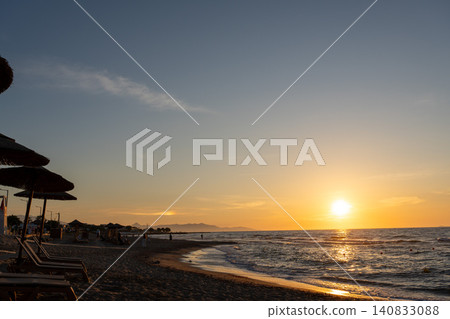 Scenic ocean sunset at a coastal holiday resort beach 140833088