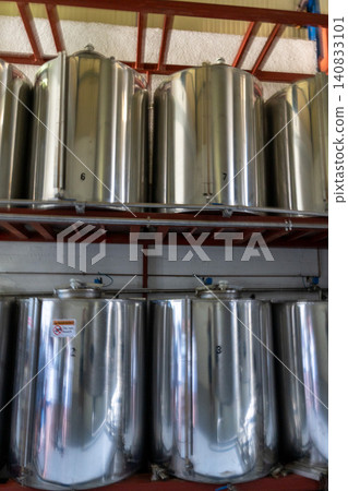 Stainless steel storage tanks inside olive oil factory on Crete Stainless steel storage tanks inside olive oil factory on Crete 140833101