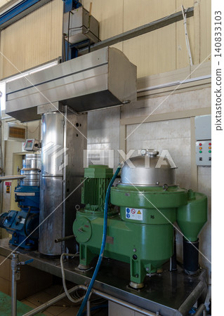 Industrial centrifuge separator machine in olive oil extraction factory 140833103