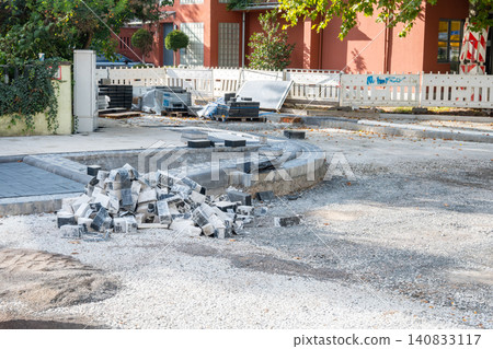 Pavement tiles for road sidewalk repair near houses. Construction process and urban infrastructure in big city. 140833117