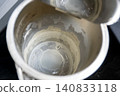 Black electric teapot with limescale surface. Hard water in metal kettle in the kitchen.Black electric teapot with limescale surface. Hard water in metal kettle in the kitchen. 140833118