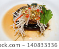 A high-end Chinese appetizer adorned with gold leaf. 140833336