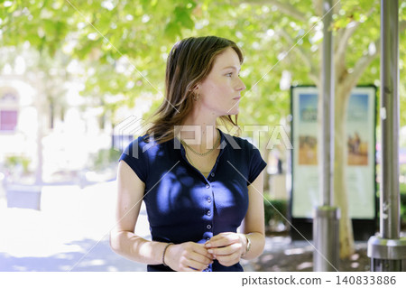 Outdoor portrait of a female university student smiling in a park 140833886