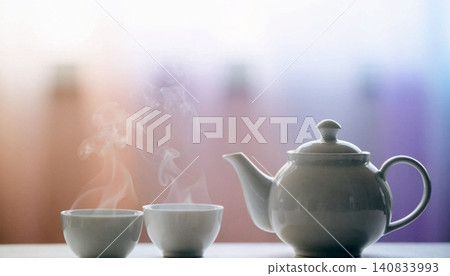 A realistic simply a white teapot and spotless white tea glasses. 140833993