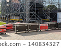 Large equipment cases lined up on pavement 140834327