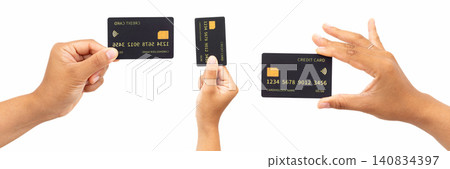 Three hands hold black credit cards against a clean white background. Each card shows a gold chip and placeholder numbers. Fingers gently display the cards, suggesting usability or choice Three hands hold black credit cards against a clean white background. Each card shows a gold chip and placeholder numbers. Fingers gently display the cards, suggesting usability or choice 140834397