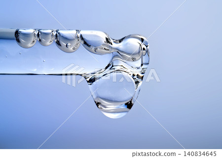 Skincare liquid dripping with hyaluronic acid essence bubbles Skincare liquid dripping with hyaluronic acid essence bubbles 140834645