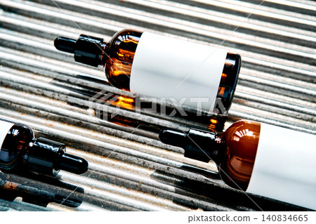 Skincare droppers presenting serum bottles on corrugated metal 140834665