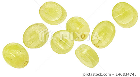 Falling green grape slices isolated on white background with clipping path Falling green grape slices isolated on white background with clipping path 140834743