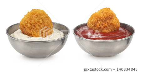 Crispy chicken nuggets served with mayonnaise and ketchup isolated on white background, golden breaded fast food snack Crispy chicken nuggets served with mayonnaise and ketchup isolated on white background, golden breaded fast food snack 140834843