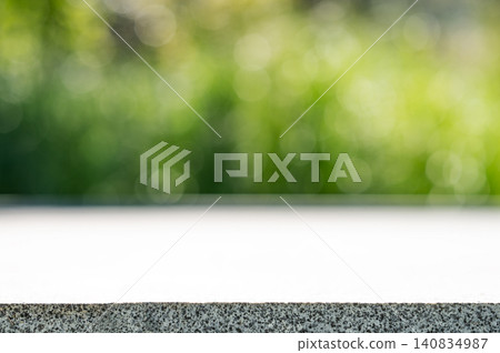 Empty concrete surface with blurred green park background and copy space Empty concrete surface with blurred green park background and copy space 140834987
