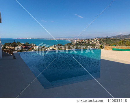 Infinity pool overlooking beautiful oropesa del mar coastline Infinity pool overlooking beautiful oropesa del mar coastline 140835548