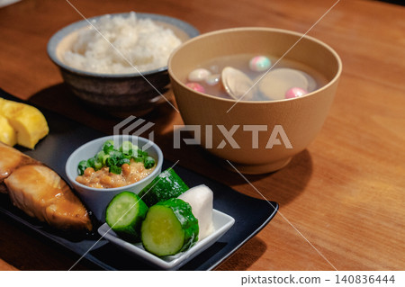 A Japanese set meal consisting of soup, rice, grilled fish, and natto (fermented soybeans). A Japanese set meal consisting of soup, rice, grilled fish, and natto (fermented soybeans). 140836444