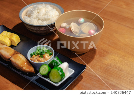 A traditional Japanese set meal consisting of soup with temari-fu (decorative wheat gluten balls) and grilled fish. A traditional Japanese set meal consisting of soup with temari-fu (decorative wheat gluten balls) and grilled fish. 140836447