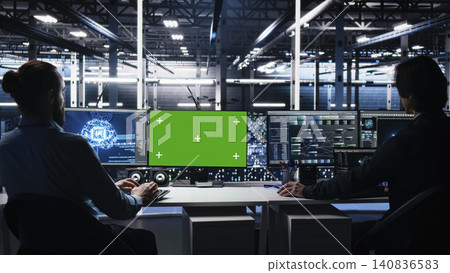 High tech server room technical specialist working on neural network software development on chroma key computer with implementing machine learning technology working with replaceable screen computer. High tech server room technical specialist working on neural network software development on chroma key computer with implementing machine learning technology working with replaceable screen computer. 140836583