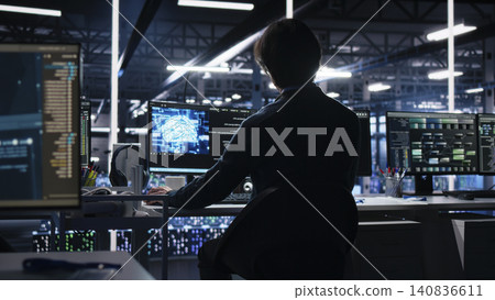 System admin in server room has coffee while working with AI to check digital infrastructure diagnostics, while enjoying a beverage in server facility while assessing operational performance with AI. 140836611