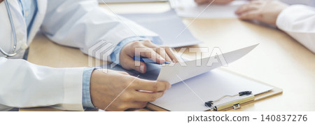 Banner hands of two women doctor medical lab discussing together healthcare teamwork. Panorama Two asian women doctors meeting write prescription medical clinic office using laptop with copy space. Banner hands of two women doctor medical lab discussing together healthcare teamwork. Panorama Two asian women doctors meeting write prescription medical clinic office using laptop with copy space. 140837276
