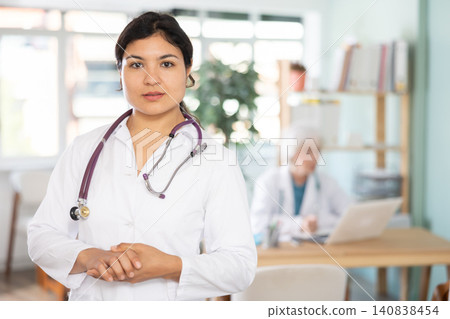 Latin woman doctor before start of appointment working day. Latin woman doctor before start of appointment working day. 140838454