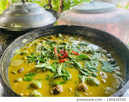 Authentic Thai Green Curry with Chicken and Eggplant in a Cooking Pot Authentic Thai Green Curry with Chicken and Eggplant in a Cooking Pot 140838500