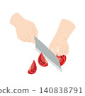 A hand cutting a tomato with a knife 140838791