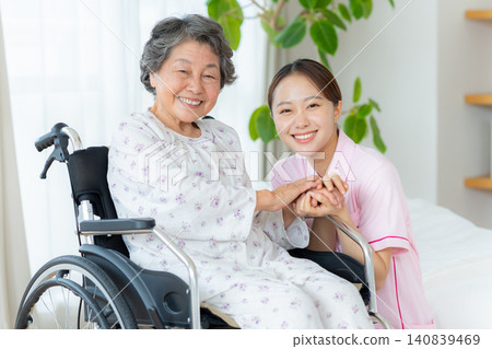 Senior woman living in a nursing home and a young caregiver 140839469