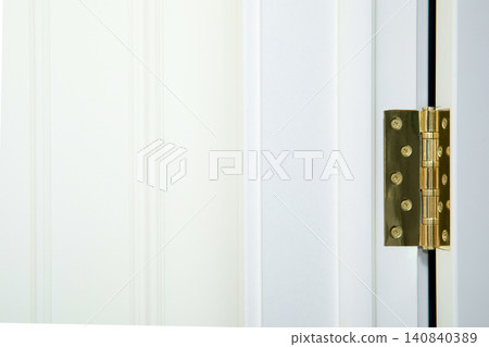 Close-up of a stylish door hinge in contemporary home Close-up of a stylish door hinge in contemporary home 140840389