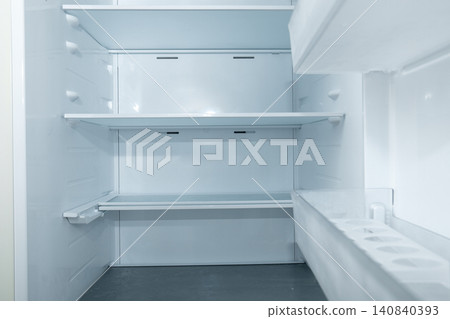Refrigerator interior showcases clean, empty shelves in bright space Refrigerator interior showcases clean, empty shelves in bright space 140840393