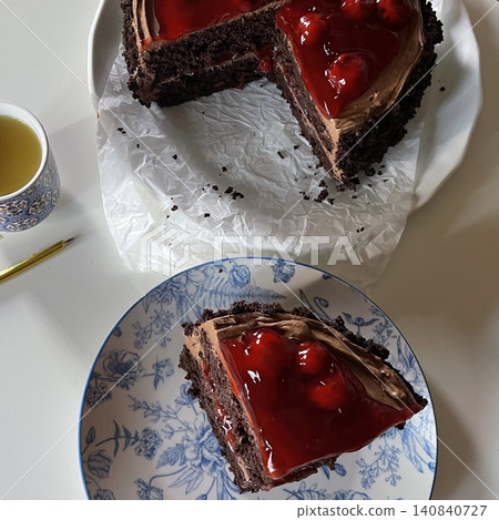 Rich, moist chocolate cake with a decadent, velvety texture and deep chocolate flavor. A perfect indulgence for dessert lovers, offering a satisfyingly sweet treat in every bite. Rich, moist chocolate cake with a decadent, velvety texture and deep chocolate flavor. A perfect indulgence for dessert lovers, offering a satisfyingly sweet treat in every bite. 140840727