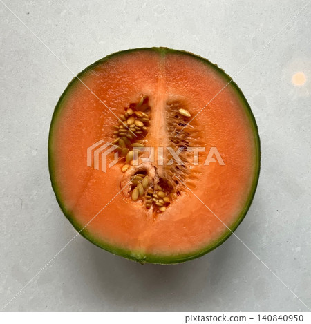 Fresh and sweet melon with a vibrant color and juicy, refreshing taste. Perfect for a healthy snack, fruit salads, smoothies, or a cooling summer treat. 140840950
