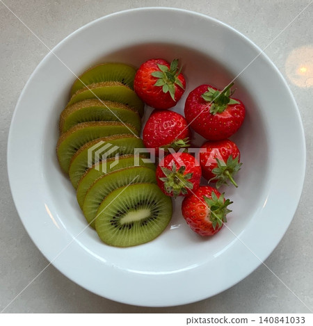 Fresh strawberries and kiwi create a vibrant mix of red and green with juicy sweetness and a zesty tang. Their bright colors and refreshing flavors make them perfect for desserts, salads, and Fresh strawberries and kiwi create a vibrant mix of red and green with juicy sweetness and a zesty tang. Their bright colors and refreshing flavors make them perfect for desserts, salads, and 140841033