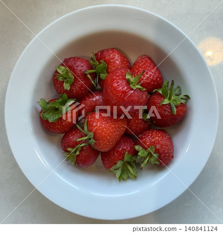 Fresh, juicy strawberries with a vibrant red color and sweet, slightly tangy flavor. Perfect for snacking, adding to desserts, smoothies, or salads, they bring a burst of natural sweetness to any dish 140841124