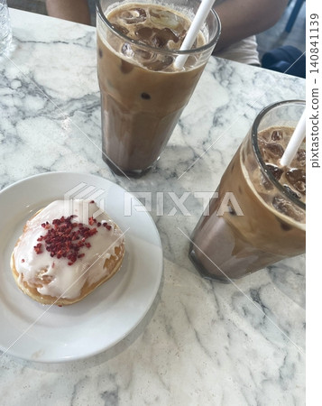 Light and creamy desserts with delicate layers, fresh fruits, and rich flavors, paired with refreshing sweet drinks. A perfect café treat for a delightful and indulgent experience. 140841139