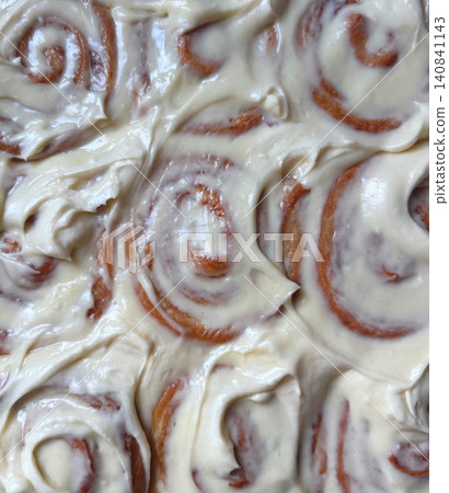 Cinnamon rolls are sweet, soft pastries swirled with a rich cinnamon and sugar filling, topped with creamy icing. Perfect for breakfast or dessert, these treats offer a warm, comforting aroma. Cinnamon rolls are sweet, soft pastries swirled with a rich cinnamon and sugar filling, topped with creamy icing. Perfect for breakfast or dessert, these treats offer a warm, comforting aroma. 140841143