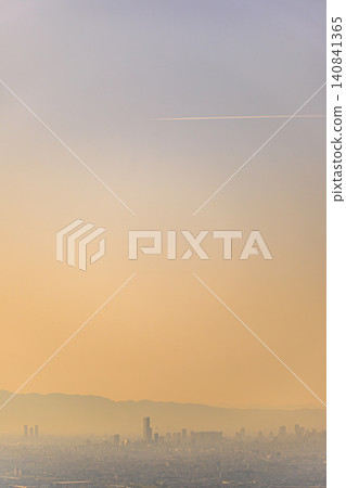 The Osaka sunset scene, where distant mountain ranges and skyscrapers create a beautiful contrast. The Osaka sunset scene, where distant mountain ranges and skyscrapers create a beautiful contrast. 140841365