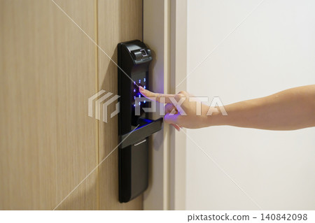 Hand press PIN number for smart digital door lock while open or close the door at home or apartment. NFC Technology, Fingerprint scan, keycard, smartphone and contactless lifestyle concepts Hand press PIN number for smart digital door lock while open or close the door at home or apartment. NFC Technology, Fingerprint scan, keycard, smartphone and contactless lifestyle concepts 140842098