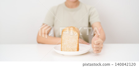 Happy smiling woman with whole wheat bread and thumbs up gesture. Weight loss, Dieting, Healthy eating, Calorie control, Fitness food, High fiber, Wellness, Lifestyle, Metabolism and Glycemic Index Happy smiling woman with whole wheat bread and thumbs up gesture. Weight loss, Dieting, Healthy eating, Calorie control, Fitness food, High fiber, Wellness, Lifestyle, Metabolism and Glycemic Index 140842120