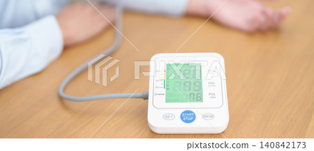 Man checking Blood pressure by Blood pressure monitor with Cuff. Systolic, SYS, Diastolic, DIA, Pulse, Hypertension, Hypotension, Heart rate, Cardiovascular Disease and May World hypertension day Man checking Blood pressure by Blood pressure monitor with Cuff. Systolic, SYS, Diastolic, DIA, Pulse, Hypertension, Hypotension, Heart rate, Cardiovascular Disease and May World hypertension day 140842173