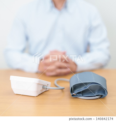 Man checking Blood pressure by Blood pressure monitor with Cuff. Systolic, SYS, Diastolic, DIA, Pulse, Hypertension, Hypotension, Heart rate, Cardiovascular Disease and May World hypertension day Man checking Blood pressure by Blood pressure monitor with Cuff. Systolic, SYS, Diastolic, DIA, Pulse, Hypertension, Hypotension, Heart rate, Cardiovascular Disease and May World hypertension day 140842174