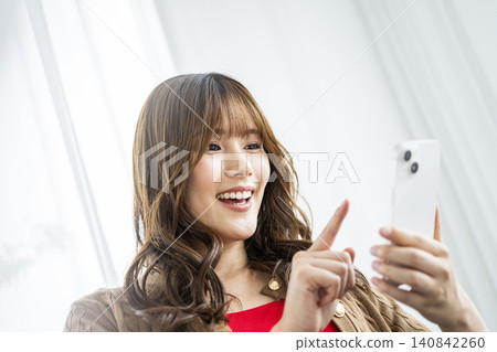 Young woman, smartphone, smiling, search 140842260