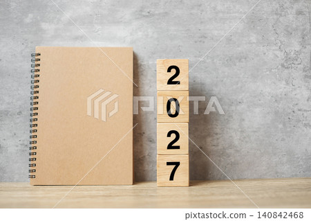 2027 Happy New Year with blank notebook and wooden number. countdown, Resolution, Goals, Plan, Action and Mission Concept 2027 Happy New Year with blank notebook and wooden number. countdown, Resolution, Goals, Plan, Action and Mission Concept 140842468