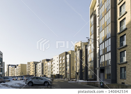 Minsk Belarus March 8 2026 Modern residential complex, living houses, apartment blocks of flats, landscape with blue sky, cars. Minsk Belarus March 8 2026 Modern residential complex, living houses, apartment blocks of flats, landscape with blue sky, cars. 140842534