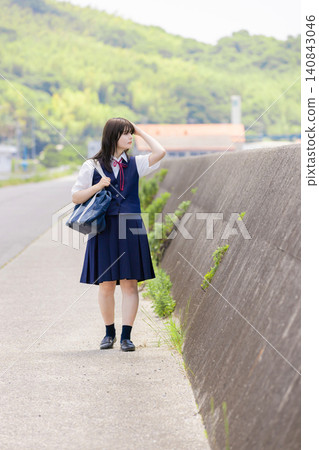 Portrait of a high school girl walking along a beach road Portrait of a high school girl walking along a beach road 140843046