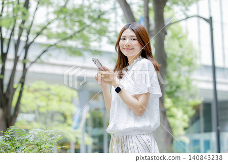 Portrait of a Japanese woman using a smartphone Portrait of a Japanese woman using a smartphone 140843238