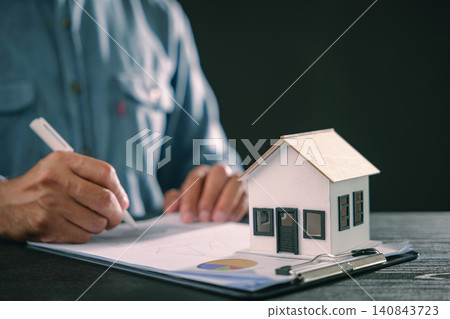 Property, mortgage, estate, loan, contract, house, paperwork, investment signing, person using pen for document beside home model, financial plan for ownership, buying home purchase Property, mortgage, estate, loan, contract, house, paperwork, investment signing, person using pen for document beside home model, financial plan for ownership, buying home purchase 140843723