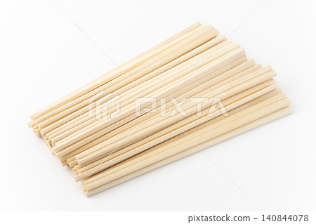 A lot of disposable chopsticks against a white background 140844078