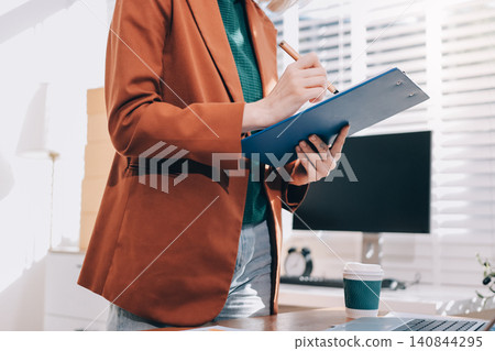 Fashion designer woman and typing on laptop in shop for email project or online order of fabric in creative startup Serious tailor computer and small business for clothes or textile in : Generative AI Fashion designer woman and typing on laptop in shop for email project or online order of fabric in creative startup Serious tailor computer and small business for clothes or textile in : Generative AI 140844295
