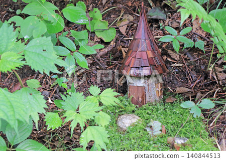 Miniature house in the forest Miniature house in the forest 140844513